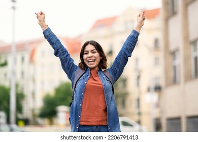 Portrait Of Happy Middle Eastern Female Student Celebrating Success Outdoors At Campus, Cheerful Young Arab Woman Raising Hands And Exclaiming With Excitement, Successfully Passed Exam, Copy Space