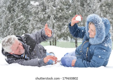 Portrait Of A Happy Middle-aged Couple On A Walk In Winter