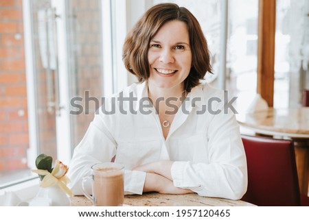 Similar – Image, Stock Photo A middle-aged woman, alone, watches television, looking sad