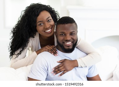 Portrait Of Happy Millenial African American Couple Posing To Camera At Home, Copy Space