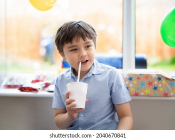 Portrait Happy Mixed Race Child Boy Drinking Water Or Juice From Paper Cup, Cute Young Kid With Smiling Face Having Fun In Birthday Party Event