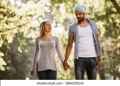 Portrait Of Happy Mixed Race Couple In Walking.