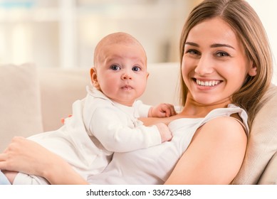 Portrait Of Happy Mother And Baby At Home