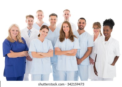 Portrait of happy multiethnic medical team standing against white background