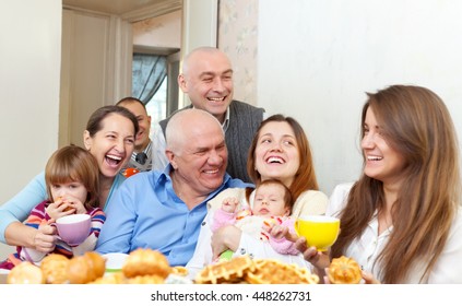 Portrait Of Happy Multigeneration Family With Baby At Home