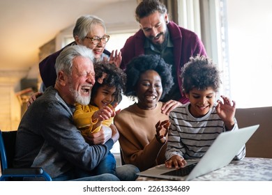 Portrait of a happy multigenerational multiethnic family at home. - Powered by Shutterstock