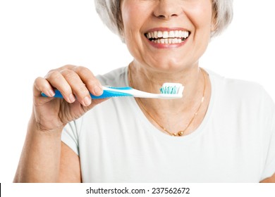 Portrait Of A Happy Old Woman Brushing Her Teeth