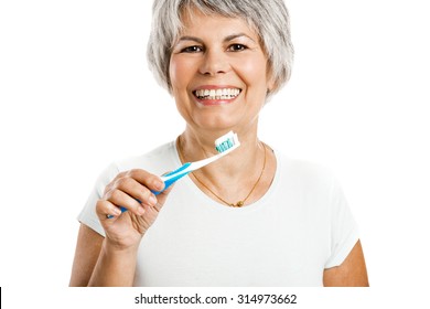 Portrait Of A Happy Old Woman Brushing Her Teeth