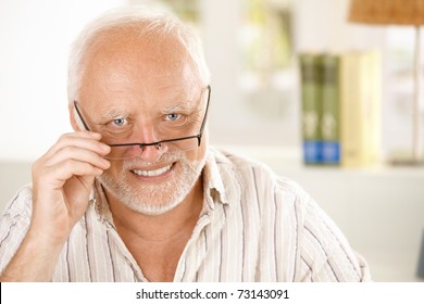 Portrait Of Happy Older Man Wearing Glasses, Looking At Camera, Smiling.?