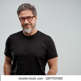 Portrait Of Happy Older White Man, Beard Gray Hair, Smiling. Gray Background,