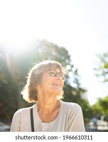 Portrait Happy Older Woman Smiling Outside On Sunny Day 