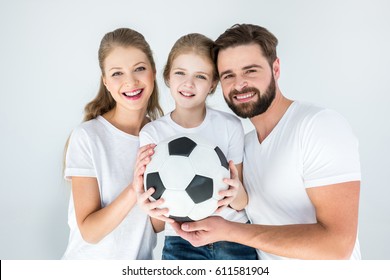 Portrait Of Happy Parents And Daughter Holding Soccer Ball  Isolated On White