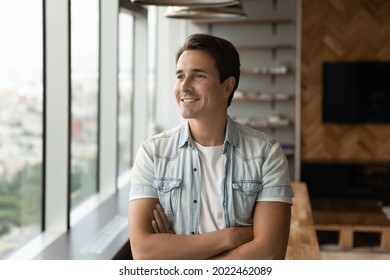 Portrait Of Happy Pensive Businessman In Casual Looking At Window Away With Folded Arms. Confident Male Business Leader Thinking Over Company Growth, Success, Good Future. Head Shot