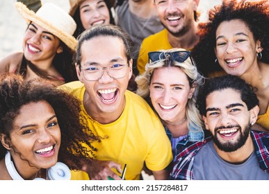 Portrait of happy people looking at the camera and smiling, young guys and girls of generation z at music festival, positive emotion and happiness of a multiracial group - Shutterstock ID 2157284817