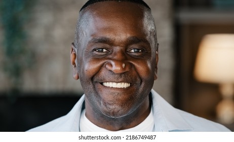 Portrait Happy Positive African American Man Intelligent Older Businessman Father Adult Friendly Person. Close Up Male Face Gaze Looking At Camera Smiling Cheerful Expressing Toothy Smile Good