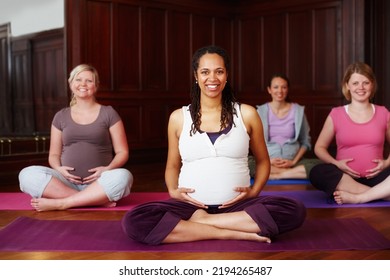 Portrait Of Happy Pregnant Women In Yoga With Leader Or Teacher Teaching In Training Or Class For Fitness And Meditation. Pilates Exercise Or Workout With Group For Pregnancy Wellness And Health