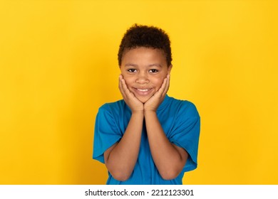 Portrait Of Happy Preteen Boy Looking At Camera And Smiling. Multiracial Child Wearing Blue T-shirt Expressing Admiration. Awe And Happiness Concept