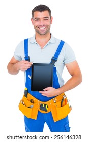 Portrait Of Happy Repairman In Overalls Holding Digital Tablet On White Background