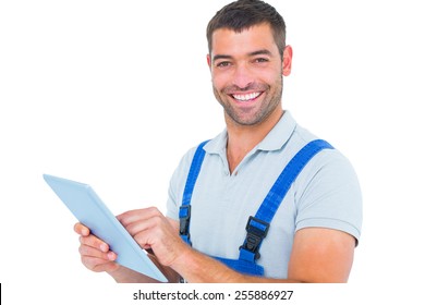 Portrait Of Happy Repairman Using Digital Tablet On White Background