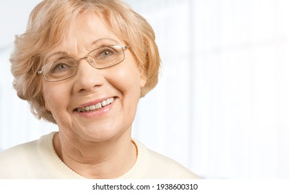 Portrait Of Happy Retired Senior Woman Wearing New Eyeglasses.