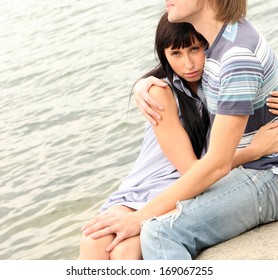 Portrait Of A Happy Romantic Sexy Couple In Love Embracing Together On The Beach At Summer Day On Blue Water Background No Face