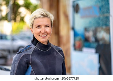 Portrait Of A Happy Scuba Diver With Wet Suit Already On, Spain