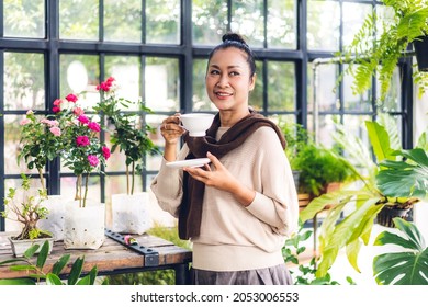 Portrait of happy senior adult elderly asian woman relaxing drinking cup of hot coffee or tea.Old woman felling enjoy having breakfast in holiday morning vacation in garden at home - Powered by Shutterstock