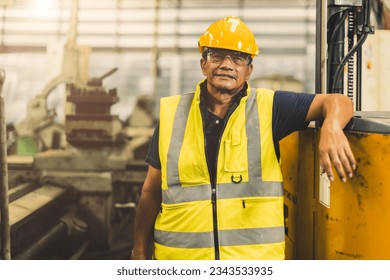 portrait happy senior Asian engineer worker adult staff working in heavy industry with safety - Shutterstock ID 2343533935