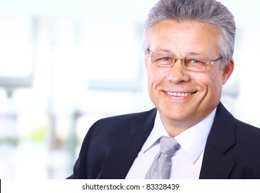 Portrait Of A Happy Senior Business Man Smiling