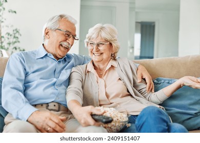 Portrait of a happy senior couple embracing hugging and having fun at home - Powered by Shutterstock