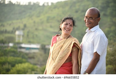 portrait of happy senior couple husband and wife wearing Indian clothing.