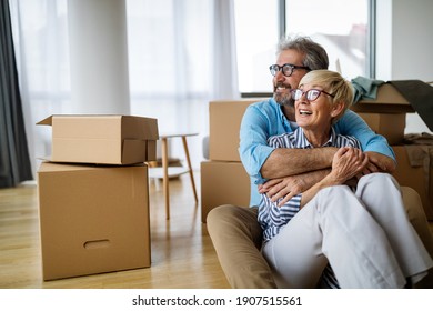 Portrait Of Happy Senior Couple In Love Moving In New Home