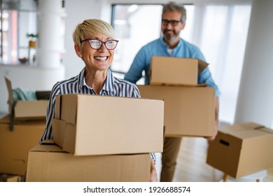 Portrait of happy senior couple in love moving in new home - Powered by Shutterstock