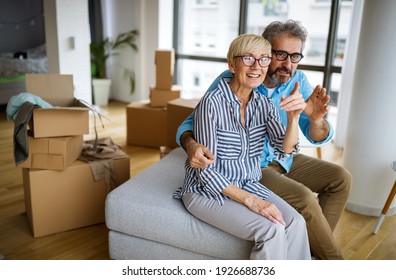 Portrait Of Happy Senior Couple In Love Moving In New Home