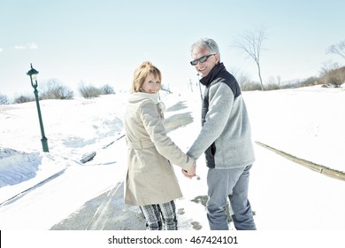 Portrait Of Happy Senior Couple In Winter Season