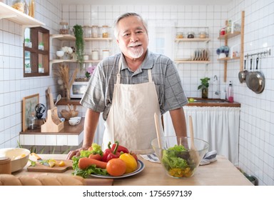 Portrait Of Happy Senior Elderly Asian Grandmother Standing Cooking Meal In Kitchen,Old Women Prepare Dinner In Hobby Lifestyle.