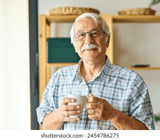 Portrait of a happy senior elderly man posing at home - Powered by Shutterstock