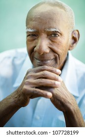 Portrait Of Happy Senior Hispanic Man Looking At Camera And Smiling