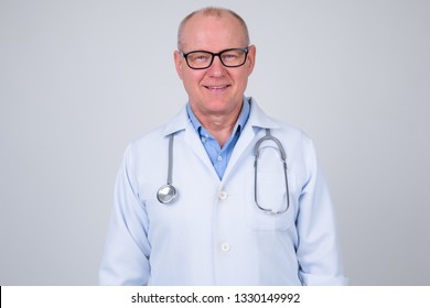 Portrait Of Happy Senior Man Doctor Smiling