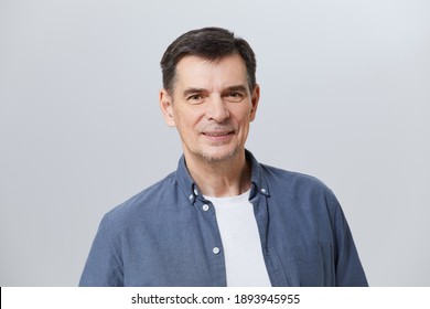 Portrait Of  Happy Senior With  Smart Casual, Real People Studio Shot With Copy Space On Gray Background.