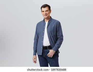 Portrait of  happy senior with  smart casual, real people studio shot with copy space on gray background. - Shutterstock ID 1897830688