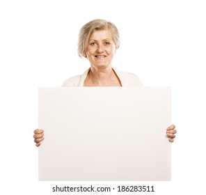 Portrait of happy senior woman with blank advertising board or copy space, isolated on white