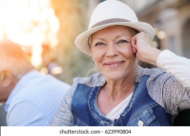 Portrait Of Happy Senior Woman With Hat On