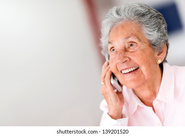 Portrait Of A Happy Senior Woman On The Phone