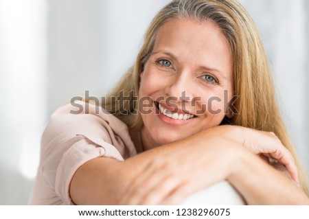 Similar – Image, Stock Photo Blonde woman leaning on a white wall while looking camera