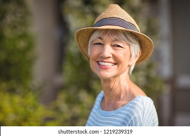 Portrait of a happy senior woman in straw hat - Powered by Shutterstock