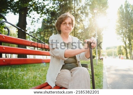 Similar – Smiling senior woman in wheelchair