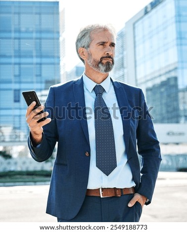 Portrait of a happy smart inteligent senior businessman smiling using a phone smartphone standing in the front of the office building