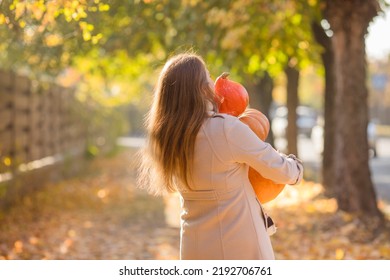 Portrait Of Happy Smile Woman With Pumpkins In Hand.