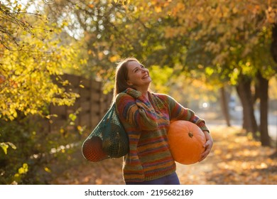 Portrait Of Happy Smile Woman With Pumpkins In Hand.